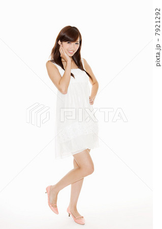 Woman wearing white sundress, studio shot 7921292
