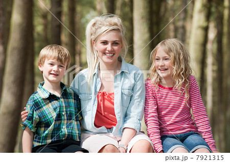 Teenage girl with younger brother and sister 7921315