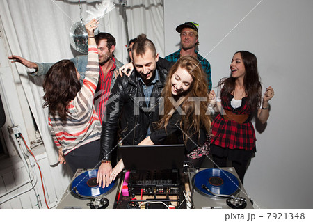 Disc jockeys dancing at party 7921348