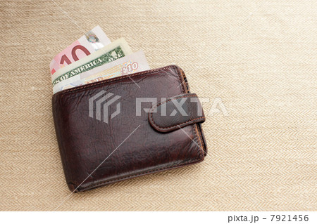 Brown leather wallet with various currencies Brown leather wallet with various currencies 7921456