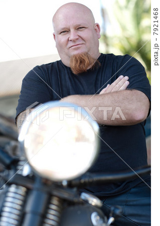 Man standing by motorcycle Man standing by motorcycle 7921468