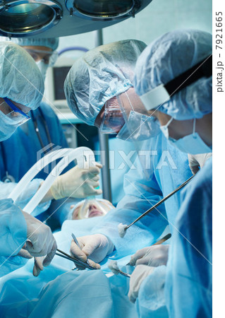 Team of surgeons during operation 7921665