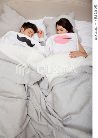 Couple in bed with lips and moustache Couple in bed with lips and moustache 7921800