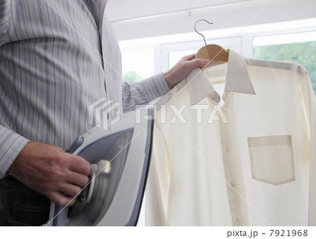 Man with shirt and iron 7921968
