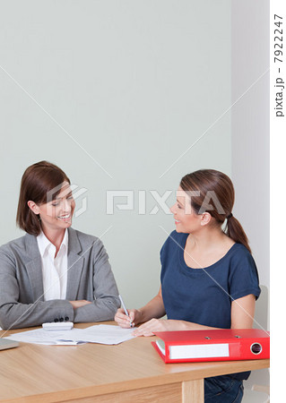 Young woman with financial adviser 7922247