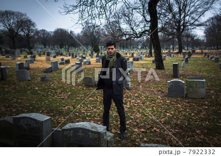 Man visiting graveyard Man visiting graveyard 7922332