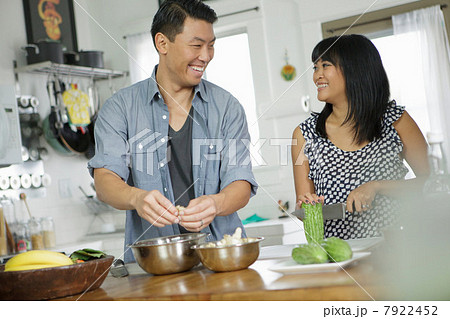 Couple cooking together in kitchen Couple cooking together in kitchen 7922452