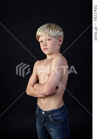 Topless boy with arms crossed 7922492