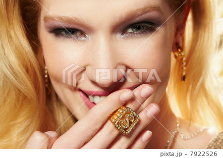 Close up portrait of young woman wearing diamond signet ring 7922526