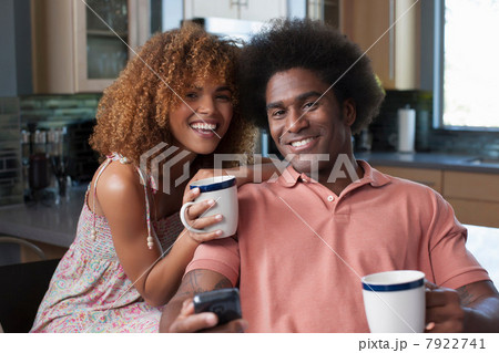 Mid adult woman and mature man holding coffee mugs, portrait Mid adult woman and mature man holding coffee mugs, portrait 7922741