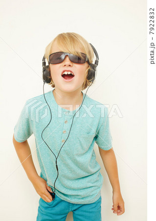 Boy wearing headphones and sunglasses 7922832