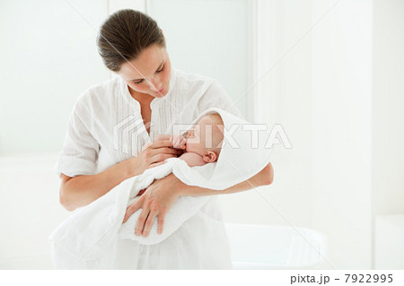 Mother and baby son wrapped in towel 7922995