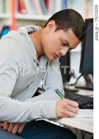 University student working at computer desk 7923006