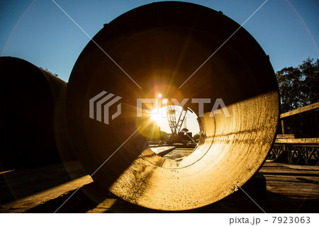 Sunrise viewed through concrete pipe Sunrise viewed through concrete pipe 7923063