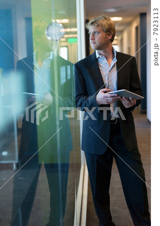 Businessman with tablet in office 7923113