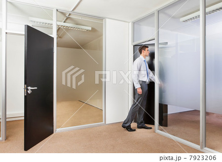 Office worker in office doorway Office worker in office doorway 7923206