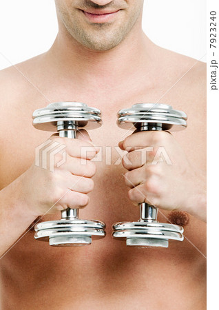 Young man with hand weights Young man with hand weights 7923240