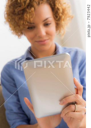 Young woman with electronic book 7923442