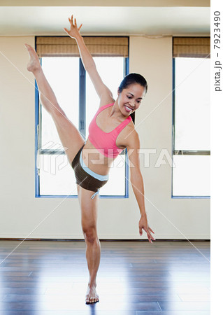 Woman stretching in dance studio 7923490