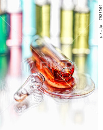 Close up of spilled vial of liquid 7923566