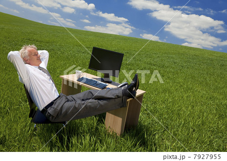 Businessman Relaxing In a Green Field Office 7927955