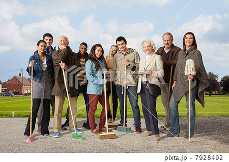 Group of people standing with brooms and mop 7928492