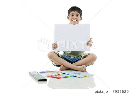Boy holding a white board Boy holding a white board 7932629