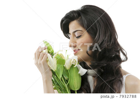 A beautiful woman holding flowers A beautiful woman holding flowers 7932788