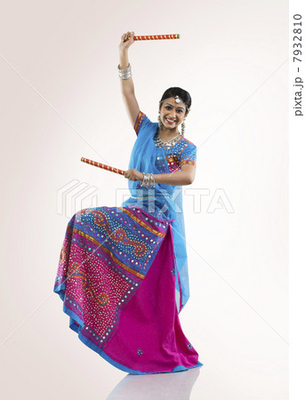Gujarati woman with dandiya sticks Gujarati woman with dandiya sticks 7932810