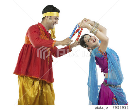Couple performing Dandiya Raas at Navratri, Stock Photo, Picture And  Royalty Free Image. Pic. SAS-PIMS-20110901-SH0442 | agefotostock