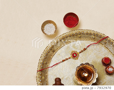 Rakhi and diya in a tray 7932970