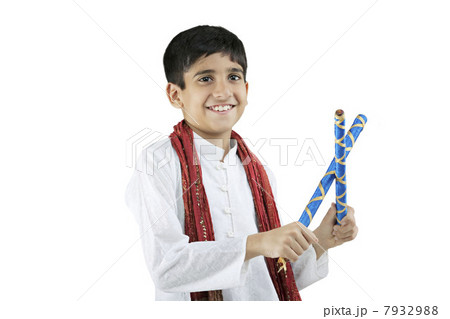 Gujarati boy with dandiya sticks 7932988