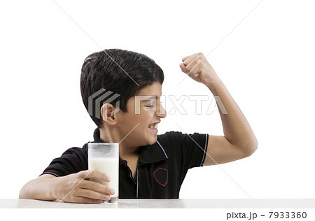 Young boy flexing his arm Young boy flexing his arm 7933360