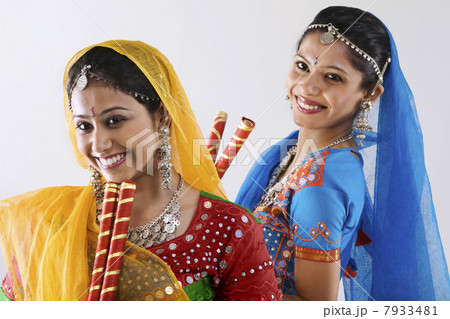 Gujarati women with dandiya sticks 7933481