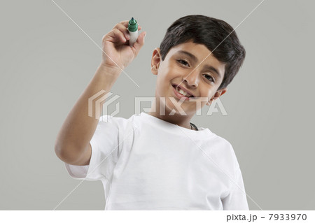 Young boy holding a marker pen Young boy holding a marker pen 7933970