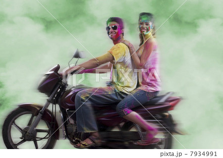 Couple riding on a motorcycle 7934991