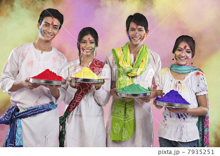 Friends holding trays with colours 7935251