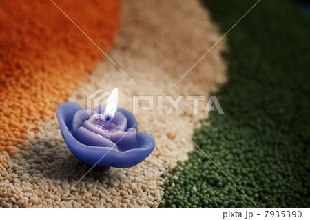 A candle in the middle of coloured pulses A candle in the middle of coloured pulses 7935390