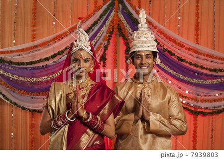 Portrait of Bengali bride and groom greeting 7939803