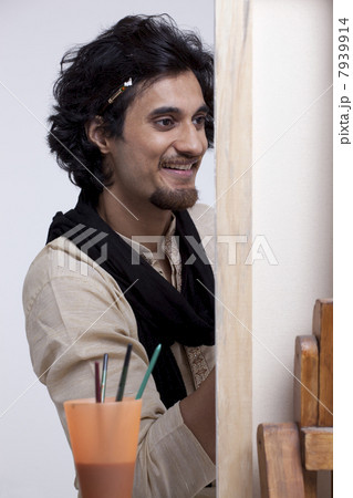 Handsome smiling artist painting 7939914