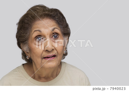 Close-up of surprised senior woman 7940023