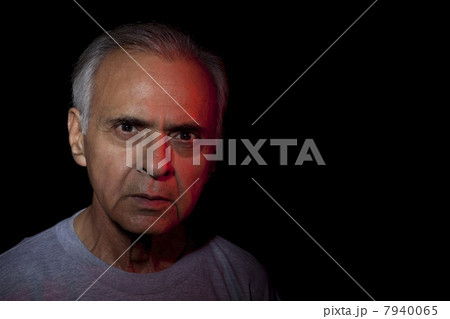Close-up portrait of man over black background 7940065
