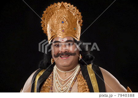 Portrait of a man dressed as Raavan smiling Portrait of a man dressed as Raavan smiling 7940388