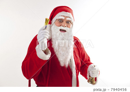 Portrait of surprised Santa Claus with chocolate and bell Portrait of surprised Santa Claus with chocolate and bell 7940456