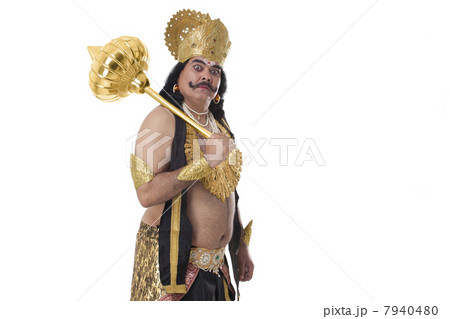 Man dressed as Raavan holding a mace Man dressed as Raavan holding a mace 7940480
