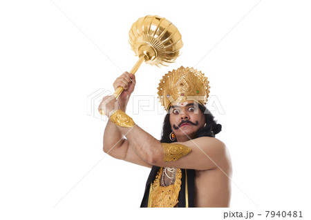 Man dressed as Raavan holding a mace 7940481
