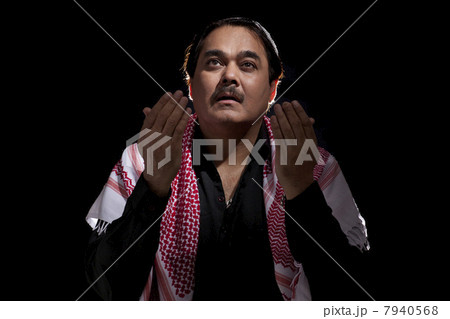 Worshiper worshiping over black background Worshiper worshiping over black background 7940568