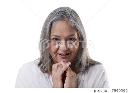 Portrait of surprised mature woman over white background 7940596