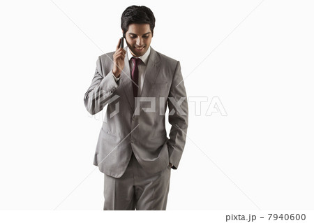 Handsome young businessman on call over white background 7940600