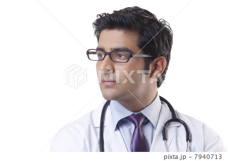 Close-up of handsome doctor over white background 7940713